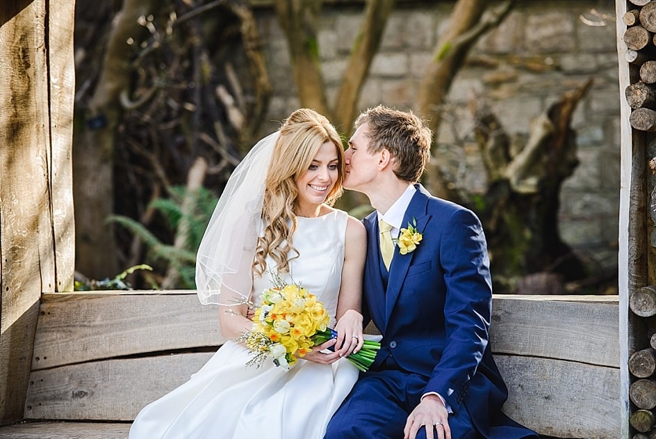Bride and groom share a moment together in the gardens of their Bristol zoo wedding