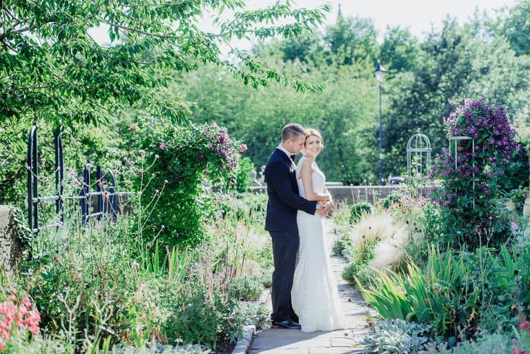 Full length shot of bride and groom in Castle park Bristol taken by Bristol wedding photographer