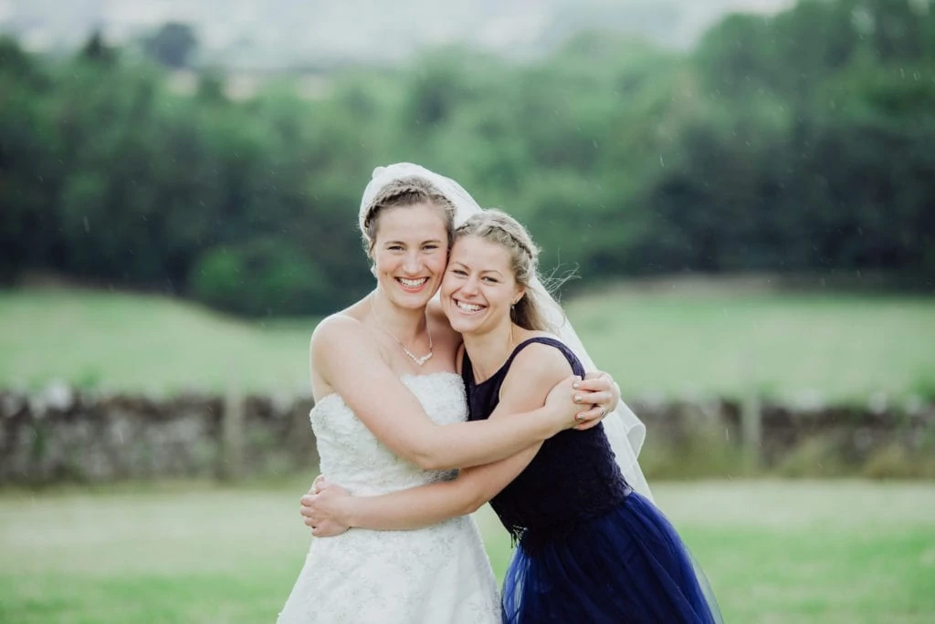 bride and her sister cuddle