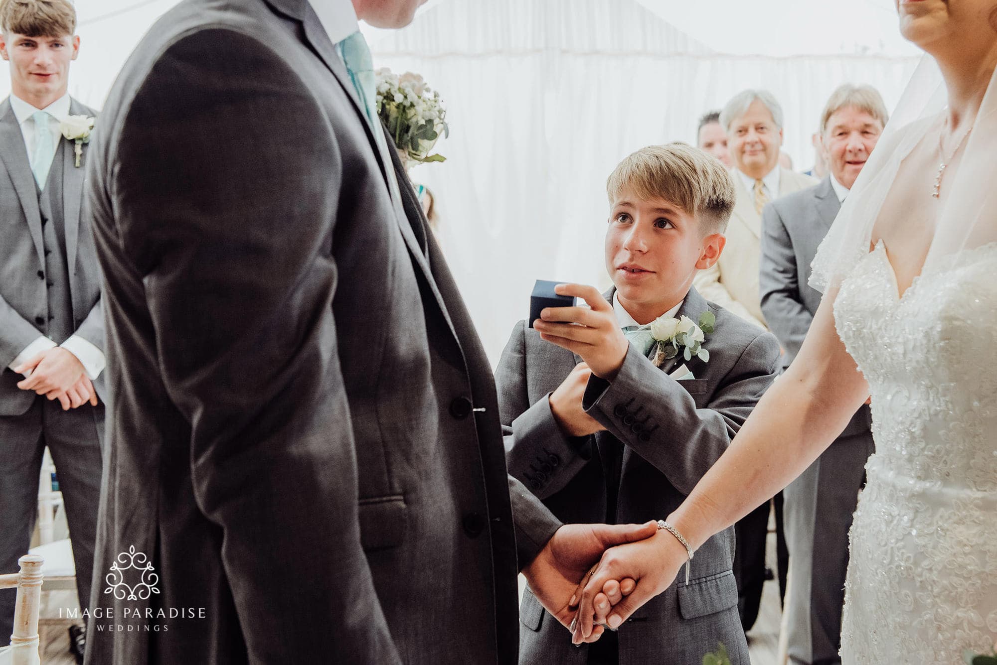 Cotswolds Hotel & Spa wedding photography | Chipping Norton photographer 17 Paige boy holds out ring during the ceremony at Cotswolds hotel and spa