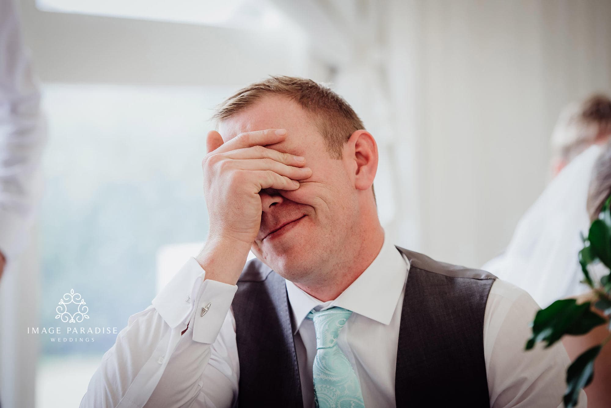 Cotswolds Hotel & Spa wedding photography | Chipping Norton photographer 37 groom holds hand to face with embarrassment at the wedding speeches