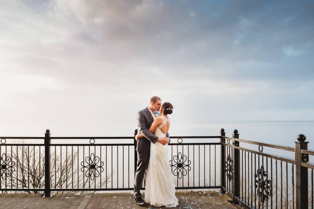 Walton-Park-hotel-wedding-photography-couple-kissing-on-the balcony