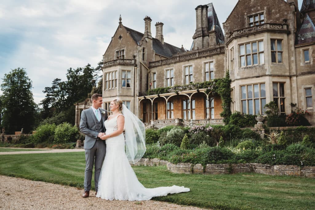 Bride and Groom stood in front of Orchardleigh House wedding venue
