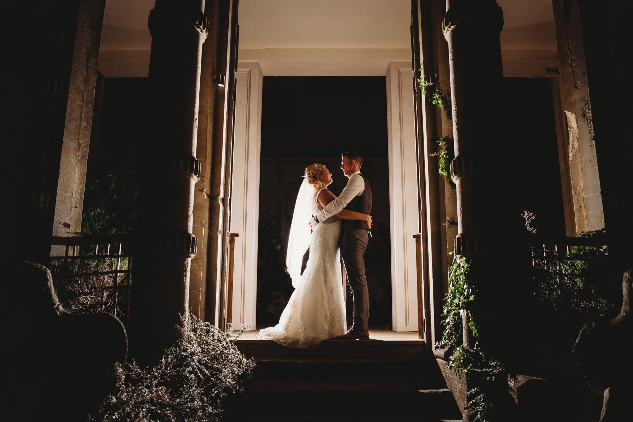 couple lit up at night at wedding venue orchardleigh house