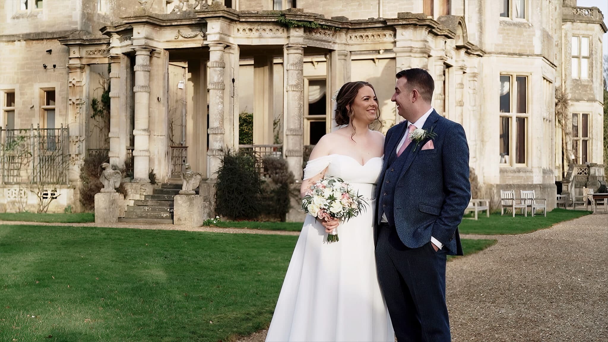 Orchardleigh wedding videographer still Frame image of a couple outside the wedding venue