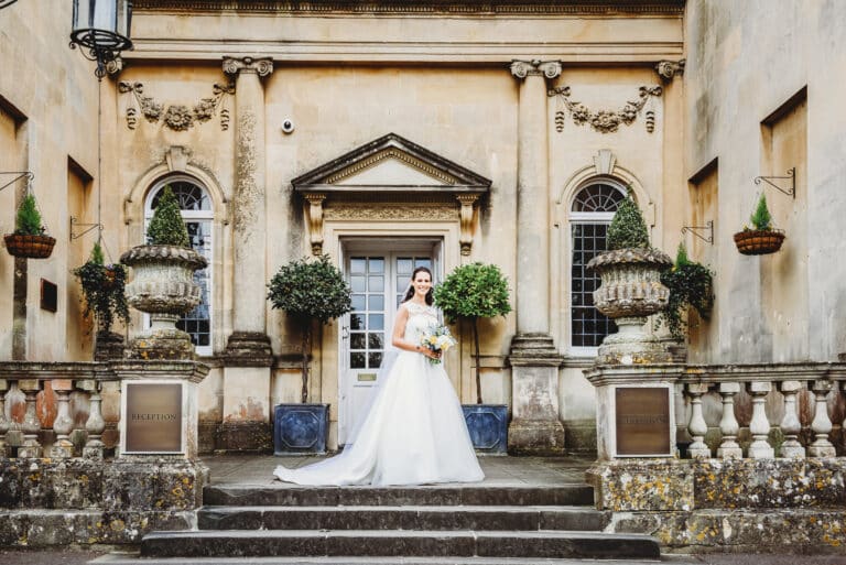 Bride stood on the steps of Bailbrook House wedding photography Bath